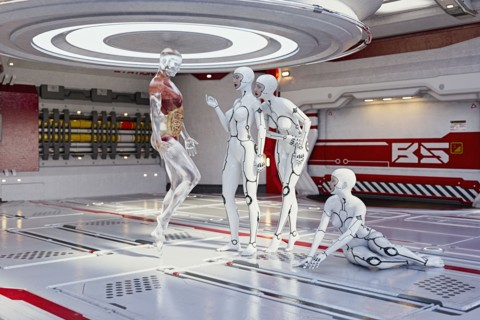 Women cyborgs examining anatomy of transparent man