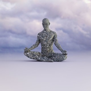 Stone man meditating under clouds