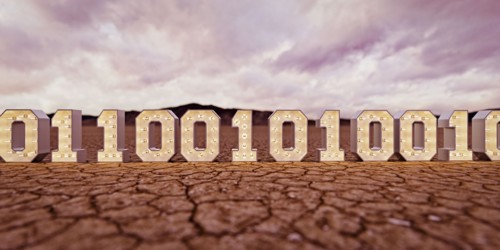 Illuminated binary code in desert