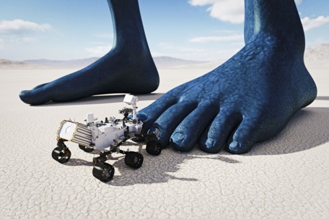 Small vehicle near feet of giant blue person