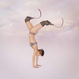Woman with artificial legs performing handstand