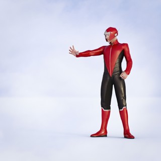 Man wearing superhero costumes gesturing stop