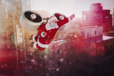 Santa flying jet pack in futuristic city