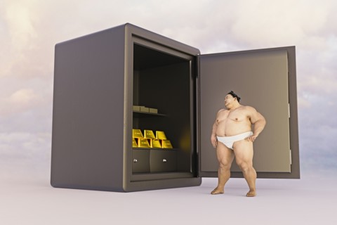 Sumo wrestler watching gold in safe