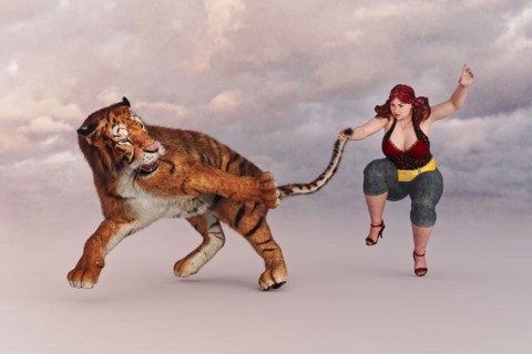 Woman holding a tiger by the tail