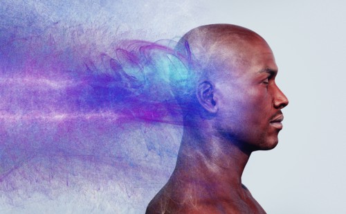 Energy flowing behind head of man