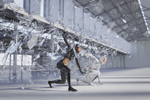 Shards of glass surrounding futuristic woman and android