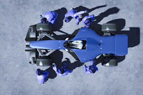 Futuristic pit crew servicing race car