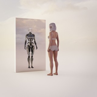 Woman looking at android reflection in mirror