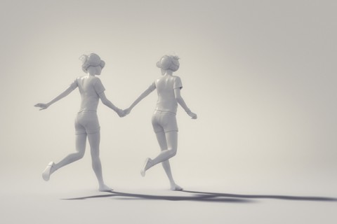 White people holding hands and running wearing virtual reality goggles