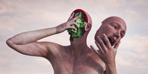 Robot man holding removable face mask and circuits