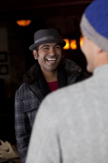 Smiling man socializing with friend