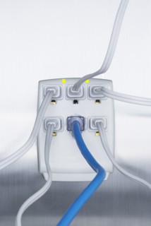 Close up of cords plugged into power strip