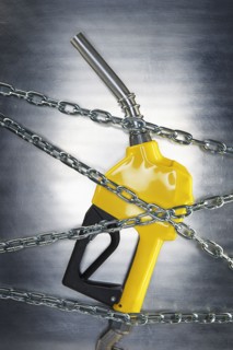 Gasoline pump nozzle tangled in chains