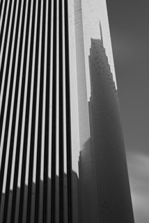 Skyscraper casting shadow on office building