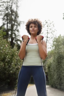 Mixed race woman exercising in park