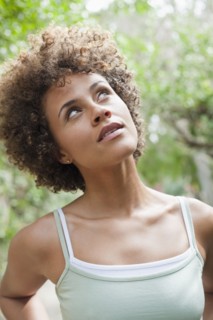 Mixed race woman looking up