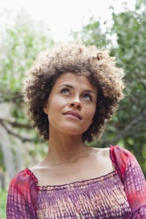 Mixed race woman looking up