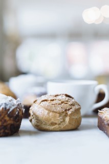 Close up of variety of pastries and coffee