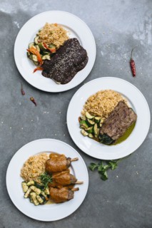 Plates of food with vegetables and rice