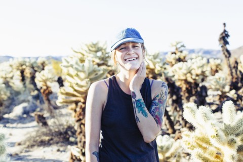 Caucasian woman smiling in desert field