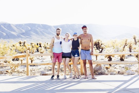 Caucasian friends smiling on desert path