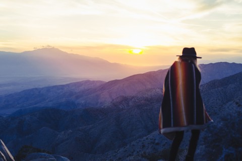 Caucasian woman overlooking remote desert landscape
