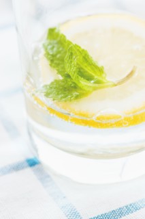 Close up of glass of herbal lemon water
