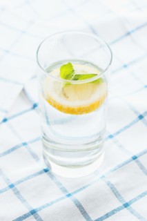 Close up of glass of herbal lemon water