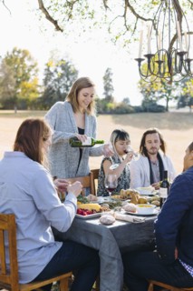 Friends eating at outdoor table