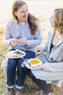 Caucasian couple eating outdoors