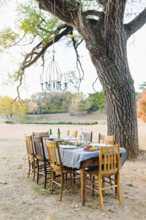 Empty dinner table in field