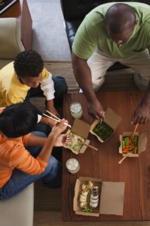 Family eating take-out Asian food