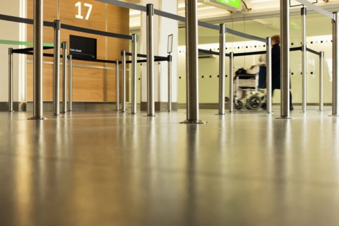 Person pushing wheelchair in airport