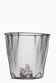 Crumpled paper in wastepaper basket