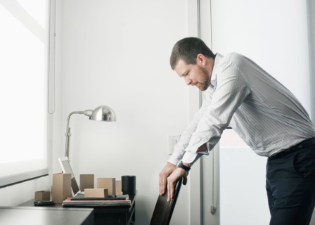 Caucasian businessman leaning on chair