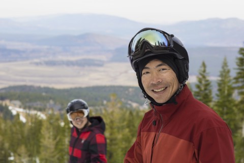 Men wearing ski gear in snow