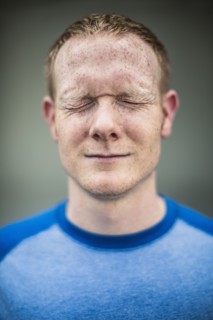 Close up of Caucasian man squinting