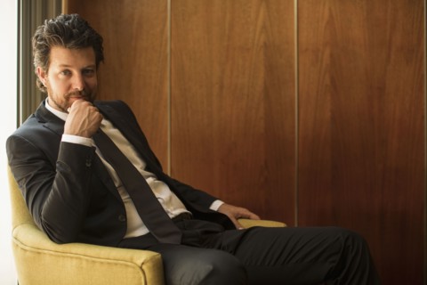 Caucasian businessman sitting in armchair