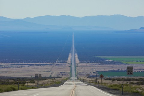 Long road through rural landscape