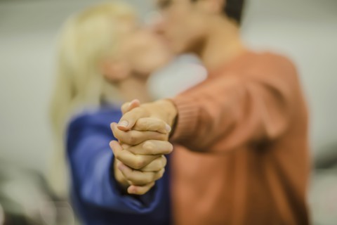 Caucasian couple holding hands