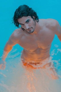 Caucasian man standing in pool