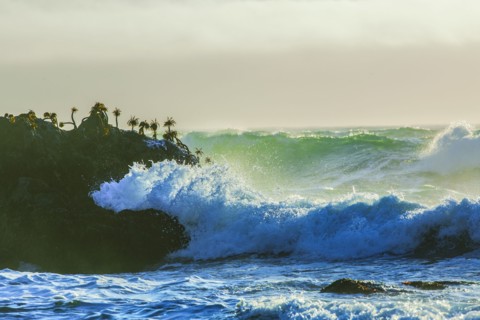 Waves crashing on cliffs