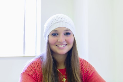 Caucasian student smiling in class