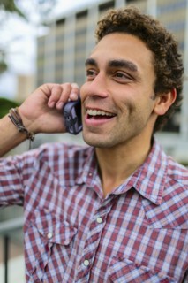 Hispanic man talking on cell phone