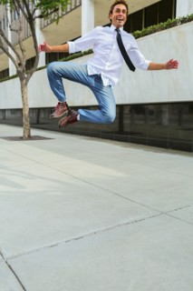 Hispanic businessman clicking his heels