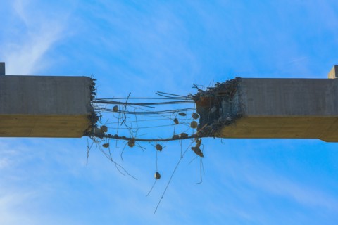 Close up of deteriorating concrete span under construction