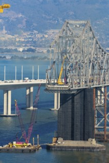Bridge under construction over bay