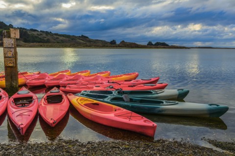 Empty canoes on calm remote lake