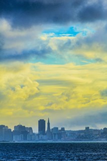 Silhouette of San Francisco city skyline under sunset sky